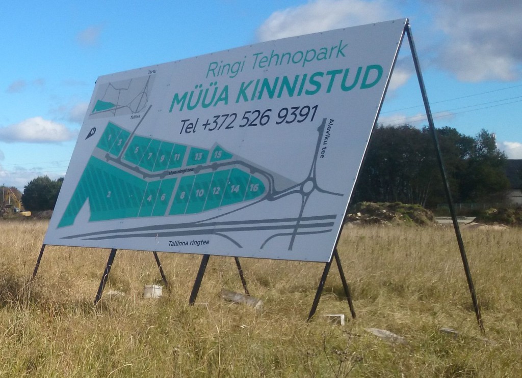 Kolmest osast koosnev kinnisvara arenduse plakat - Ringi Äripark Jüris